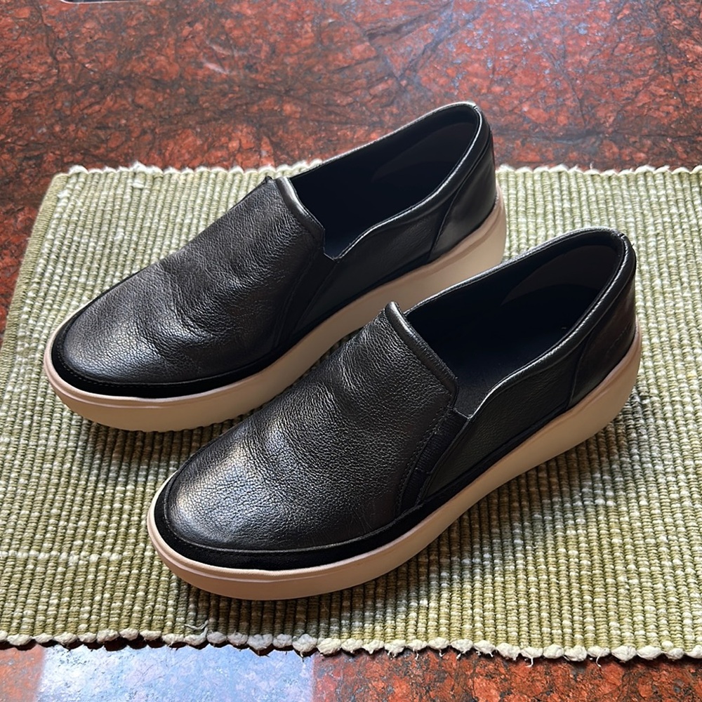 Women’s Vionic Black Leather Slip ons.
